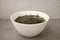 Seaweed soup in a bowl on a white background