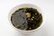 Seaweed soup in a bowl on a white background