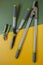 Secateurs, loppers and hedge trimmers on a yellow-green background.Garden equipment .Tools for trimming
