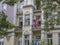 Secession house facade with balcony and colorful clothes hanging