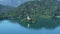 Secluded island with church surrounded by Lake Bled and Alps, spirituality