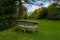 Secluded park bench in Batsford Arboretum.