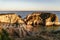 A secluded sandy beach and eroded sea arch