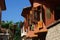 The second floor of a bright facade of houses on the old east