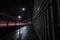 The Second Narrows Bridge sidewalk at night, with light trails from passing cars.