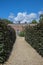 Secret garden. Gravel path leading to a walled garden gate.