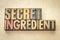 Secret ingredient word abstract in wood type