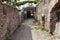 Secret paths and suggestive views in the Roman ruins at Ostia Antica, Rome Italy