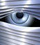 Secret, spying eye behind metal venetian blinds