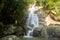 Secret tropical waterfall in jungle on a Samui island.