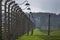 A section of the barbed wire electric fence which surrounded the Auschwitz-Birkenau Concentration Camp at Oswiecim in Poland.