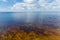 Section of big reservoir with sandy bottom against the sky