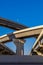 Section of elevated highway with several levels against a bright blue sky in Houston, Texas