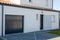 sectional door gray garage entrance facade grey home modern new building house in suburb