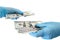 Secure money transfer.hand in rubber glove takes money.hands in sterile medical gloves concept on theme of corruption in medicine