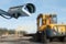 Security CCTV camera or surveillance system with industrial site on blurry background