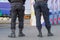 Security city guards in outfit controlling entrance. Policemen trousers and boots of modern design