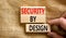 Security by design symbol. Concept words Security by design on wooden blocks on a beautiful canvas table canvas background.