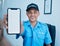 Security guard man, portrait and mobile phone screen for mockup space for promo, ux or smile in workplace. Young safety