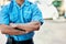 Security guard, safety officer and man with arms crossed outdoor on street for protection and patrol. Law enforcement