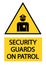 Security guards on patrol,  warning yellow triangle sign with text