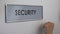 Security office door, hand knocking closeup, surveillance system, identification