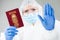 Security officer at airport customs security check holding passport