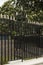 Security: Ornate, gold spear topped, fence made of black railings. 2
