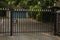 Security: Ornate, gold spear topped, gate made of black railings. 1