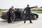 Security team of bodyguards protect celebrity vip in car limousine