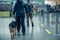 Security workers with German Shepherd dogs walking at airport