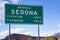 Sedona,Arizona, road sign with red rock mountain landscape