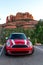 SEDONA, ARIZONA / US - August 10, 2019: Red Mini Cooper S with White Racing Stripes Parked in Sedona, Arizona