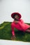 Seductive african american woman in pink dress and hat posing
