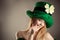 Seductive blond girl in image leprechaun