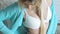 Seductive naked blonde posing in bra