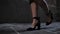 Seductive woman in beautiful dress with legs walking in Barcelona city. Slow motion. Girl in black heels, empty