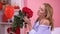 Seductive woman smelling bunch of red roses, bouquet delivery, Valentines day