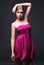 Seductive young woman wearing pink dress