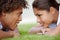 We see eye to eye. Shot of a happy young couple gazing into each others eyes on the lawn.