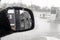 see the gas station in the right mirror of the car on the driver\\\'s side in the rain