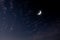 See the Islamic moon in the night sky. Evening sky and the vastness in the dark are beautiful twinkling stars. The crescent moon