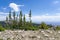 See panoramic view of Bighorn Mountain area with Montana and Wyoming plains below.