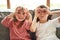 We see you. Portrait of two adorable little siblings bonding together at home.