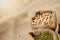 Seed of soy beans in fabric bag on linen background