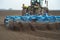 Seedbed cultivator working in farm field