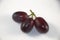 Seedless red grapes on white background