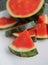 Seedless watermelon on white ceramic platter