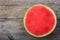 Seedless watermelon on a wooden table - top view