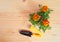 Seedlings marigold flowers and gardening tools on wooden background